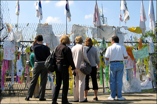 The barbed wire fence covered with flags on the wire fence at the Imjingak Pavilion